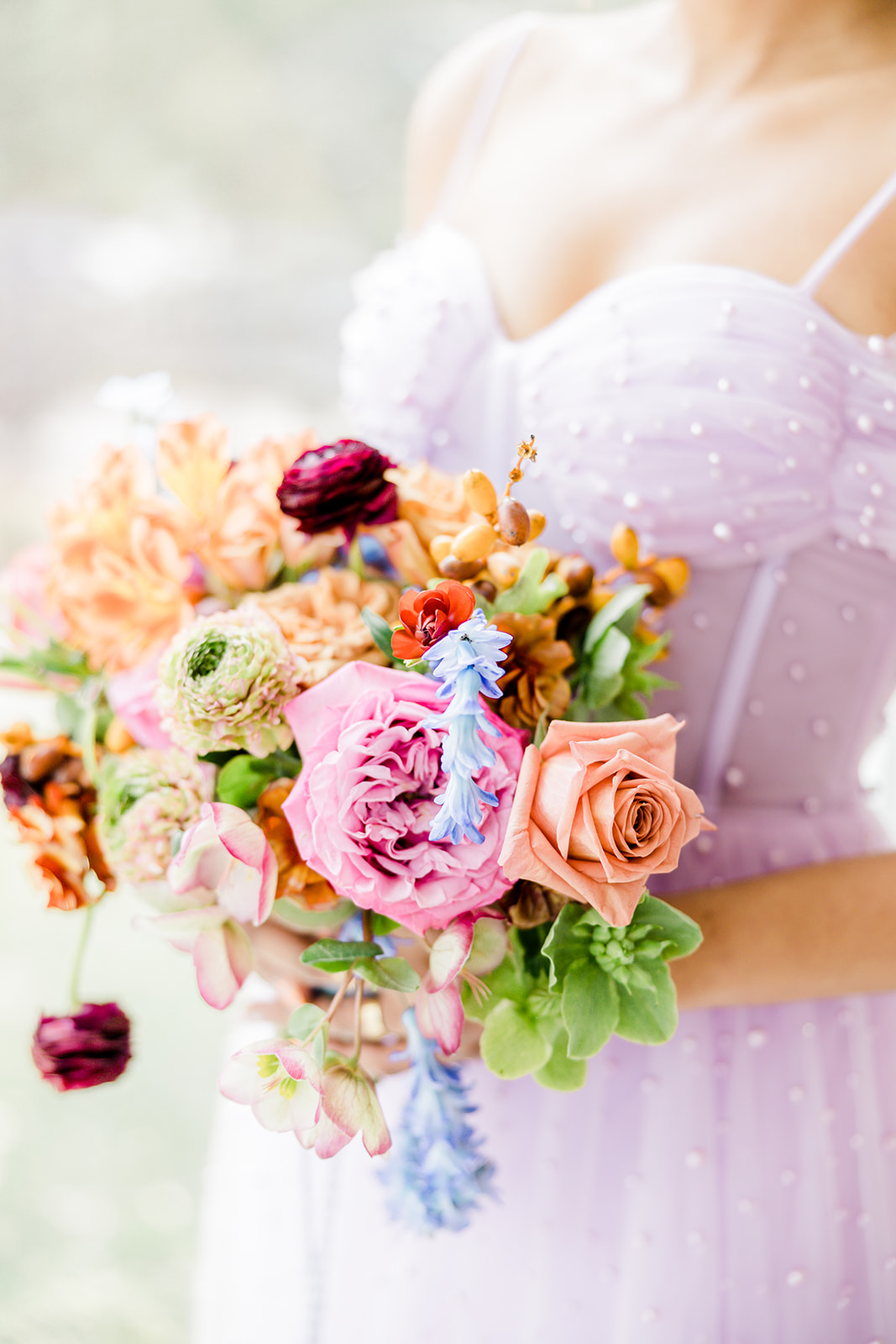 Fresh and feminine bridesmaid bouquet with a unique and fun color scheme utilizing exciting pops of color. Wedding bouquet color inspiration vibrant wedding #weddingcolorideas #colorfulwedding #bridesmaidboquet #uniqueweddingflowers